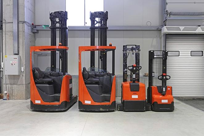 forklifts being used in a construction zone